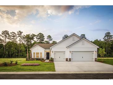 Stunning two-car garage home with white exterior at Lot 721 Zoe Way, Myrtle Beach, SC 29588