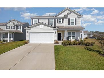 Two story house with attached garage and landscaped front yard at 5700 Redgum Dr., Myrtle Beach, SC 29579