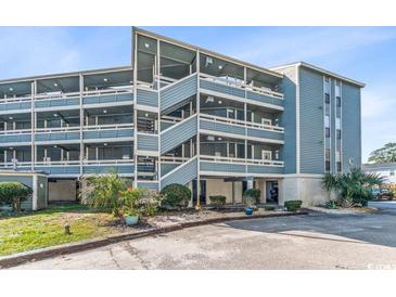 Multi-story building with balconies and parking at 1101 Possum Trot Rd. # C205, North Myrtle Beach, SC 29582