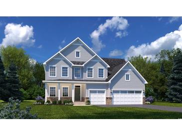 Two-story house with gray siding, three-car garage, and landscaped front yard at 731 Indigo Bay Circle, Myrtle Beach, SC 29579