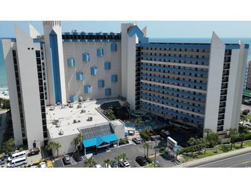Ocean Reef Resort aerial view showing building, pool, and parking at 7100 Ocean Blvd. N # 919, Myrtle Beach, SC 29572