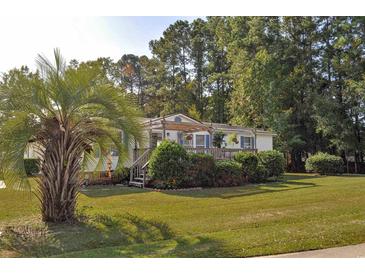 Single-story home with covered porch and landscaping at 527 Folly Estates Dr., Myrtle Beach, SC 29588