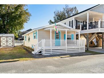 Charming cottage with a wrap-around porch at 6001 - 1749 S Kings Hwy., Myrtle Beach, SC 29575