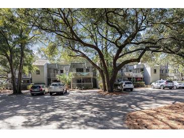 Building exterior showcasing multiple units and parking at 118 Salt Marsh Circle # 25-I, Pawleys Island, SC 29585