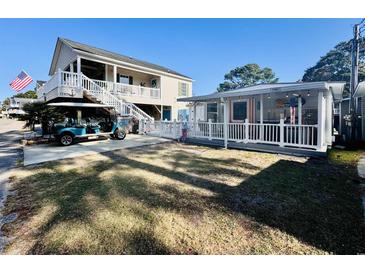 Cute beach cottage with golf cart, deck, and spacious yard at 6001 - 1781 S Kings Hwy., Myrtle Beach, SC 29575