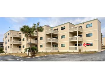 Tan colored building with multiple balconies and parking at 9661 Shore Dr. # A-38, Myrtle Beach, SC 29572