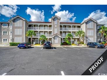 Three-story building with ample parking at 4220 Coquina Harbour Dr. # B-11, Little River, SC 29566