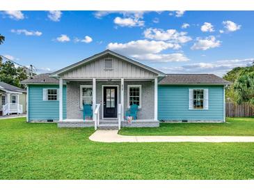 Charming light blue house with gray brick accents at 829 44Th Ave. N, Myrtle Beach, SC 29577