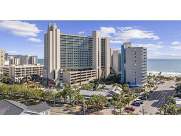 Aerial view of oceanfront resort with pool, parking and playground at 201 74Th Ave. N # 2749/50, Myrtle Beach, SC 29572