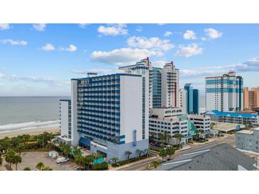 Aerial view of high rise building and beach at 2001 S Ocean Blvd. # 1005, Myrtle Beach, SC 29577