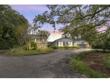 Stunning home exterior with large driveway and mature landscaping at 4809 Burchap Dr., Myrtle Beach, SC 29577