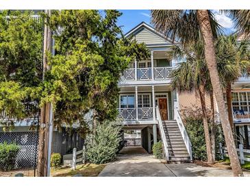 Two-story beach home with stairs and driveway at 912-B S Ocean Blvd., Surfside Beach, SC 29575