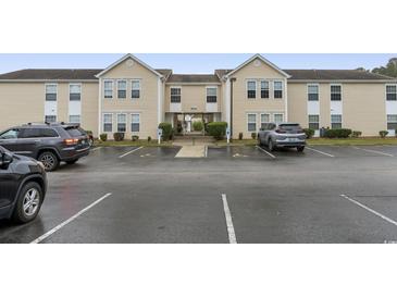 Building exterior, showing parking lot and landscaping at 8546 Hopkins Circle # G, Surfside Beach, SC 29575