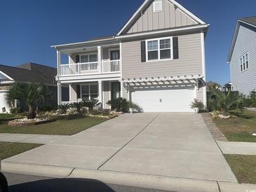 Two-story house with a gray exterior, white trim, and landscaping at 2808 Stellar Loop, Myrtle Beach, SC 29577
