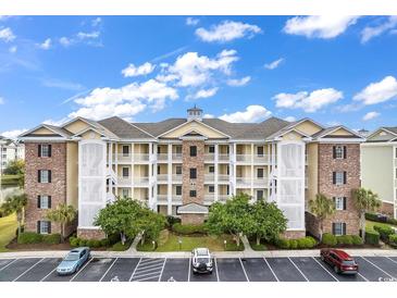 Brick building with yellow accents and landscaping at 4878 Luster Leaf Circle # 404, Myrtle Beach, SC 29577