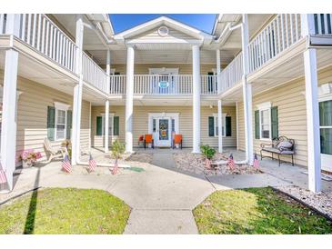 Attractive building exterior with columns, balconies, and landscaping at 5102 Sweetwater Blvd., Murrells Inlet, SC 29576