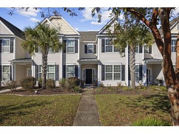 Two-story townhome with a charming front porch and landscaping at 656 Pistoia Ln. # 304, Myrtle Beach, SC 29579