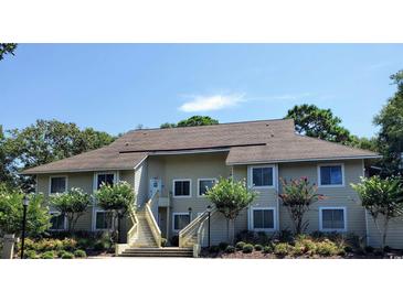 Inviting condo building with landscaping and staircase at 491 Ocean Creek Dr. # 2614, Myrtle Beach, SC 29572