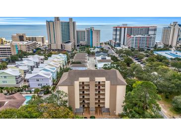 Aerial view of a condo building near the beach and other high-rise hotels at 310 73Rd Ave. N # 5-C, Myrtle Beach, SC 29572