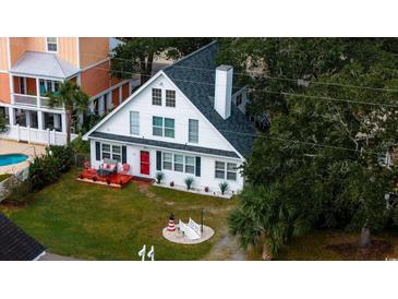 Charming two-story home with a lighthouse at 114 N Pinewood Dr. N, Surfside Beach, SC 29575