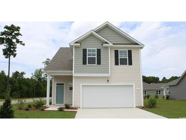 Two-story house with gray and beige siding and a two-car garage at 651 Wallace Dr., Little River, SC 29566