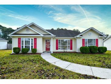 Ranch-style home with red shutters and a curved walkway at 4336 Summitt Trail, Myrtle Beach, SC 29579