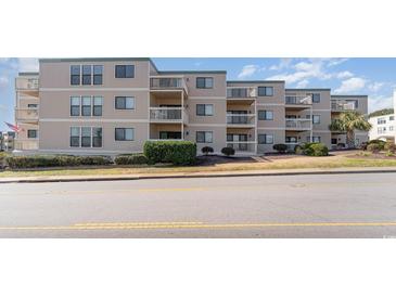 Multi-unit building exterior with multiple balconies and landscaping at 9661 Shore Dr. # B30, Myrtle Beach, SC 29572
