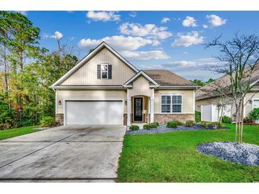 Attractive single-story house with a two-car garage and landscaped lawn at 570 Flowering Branch Ave., Little River, SC 29566