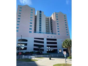 Coastal condo building with parking garage and landscaped grounds at 2001 S Ocean Blvd. # 1102, North Myrtle Beach, SC 29582