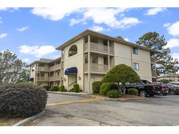 Two-story condo building with ample parking and landscaping at 4101 Pinehurst Circle # 4A, Little River, SC 29566