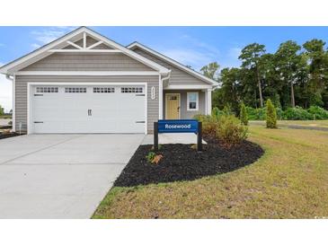 Exterior of charming craftsman style home with two car garage at 1028 Oak Meadow Dr., Conway, SC 29526
