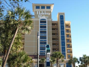 Holiday Pavilion, a multi-story building with palm trees at 1200 N Ocean Blvd. # 307, Myrtle Beach, SC 29577