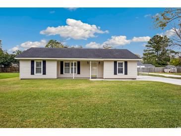 House exterior featuring a well-maintained lawn and driveway at 1919 Jasper St., Georgetown, SC 29440