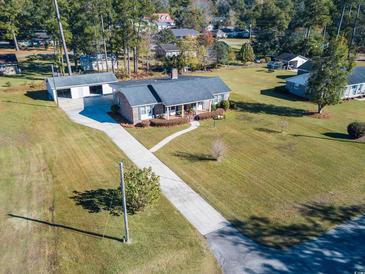 Aerial view of ranch home with large yard and detached garage at 407 Walnut Ave., Georgetown, SC 29440