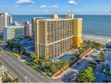 Aerial view of beachfront property with pool and parking at 6900 N Ocean Blvd. # 1540, Myrtle Beach, SC 29572