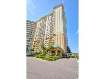 Oceanfront high-rise building with inviting entryway at 9994 Beach Club Dr. # 1806, Myrtle Beach, SC 29572