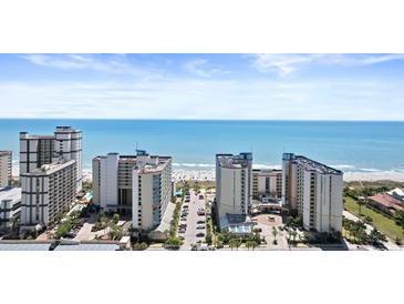 Aerial view of oceanfront resort complex with multiple buildings and parking at 5200 N Ocean Blvd. # 833, Myrtle Beach, SC 29577