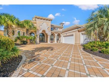 Grand two-story home with a large driveway and lush landscaping at 1501 Serena Dr., Myrtle Beach, SC 29579