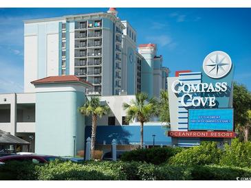 Compass Cove Oceanfront Resort: Attractive beachfront high-rise building with palm trees at 2311 S Ocean Blvd. # 967, Myrtle Beach, SC 29577