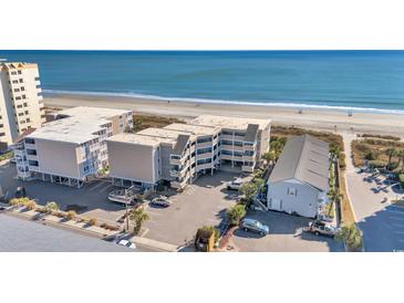 Aerial view of beachfront condo complex with parking and ocean views at 2405 S Ocean Blvd. # 306, North Myrtle Beach, SC 29582