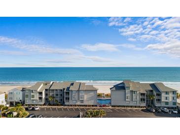 Oceanfront condo complex with parking and pool at 1011 N Ocean Blvd. # 303-B, Surfside Beach, SC 29575