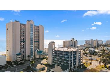 Aerial view of oceanfront condominium complex with parking garage at 3805 S Ocean Blvd. # 204, North Myrtle Beach, SC 29582