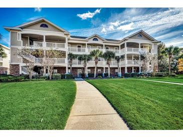 Attractive 3-story building with landscaped grounds at 5801 Oyster Catcher Dr. # 1022, North Myrtle Beach, SC 29582