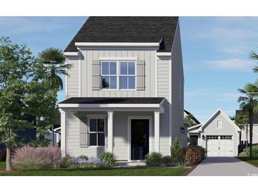 Two-story craftsman style home with gray siding, shutters, and landscaping at 2705 Rowyn St., Longs, SC 29568
