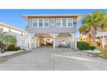 Charming elevated beach home with boat parking and spacious front yard at 310 46Th Ave. N, North Myrtle Beach, SC 29582