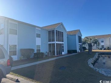 Light blue building exterior with screened porch and waterfront views at 8830 B Cloister Dr. # 8830 - B, Myrtle Beach, SC 29575