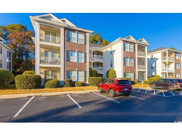 Low-country style building exterior, with ample parking at 1310 River Oaks Dr. # 2J, Myrtle Beach, SC 29579