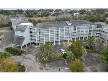 Aerial view of a light blue building with parking and landscaping at 14290 Ocean Hwy. # 407, Pawleys Island, SC 29585