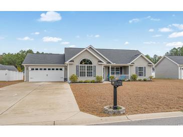 Gray house with two-car garage and landscaped yard at 480 Oakham Dr., Conway, SC 29527