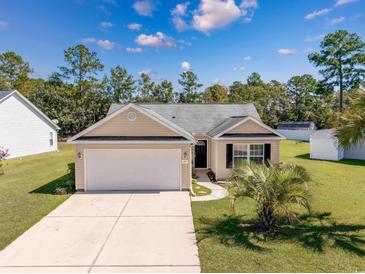 Nice curb appeal! This charming house features a large yard and a spacious driveway at 157 Ecum Secum Pl., Conway, SC 29527